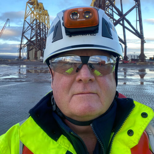John in hi viz gear on site