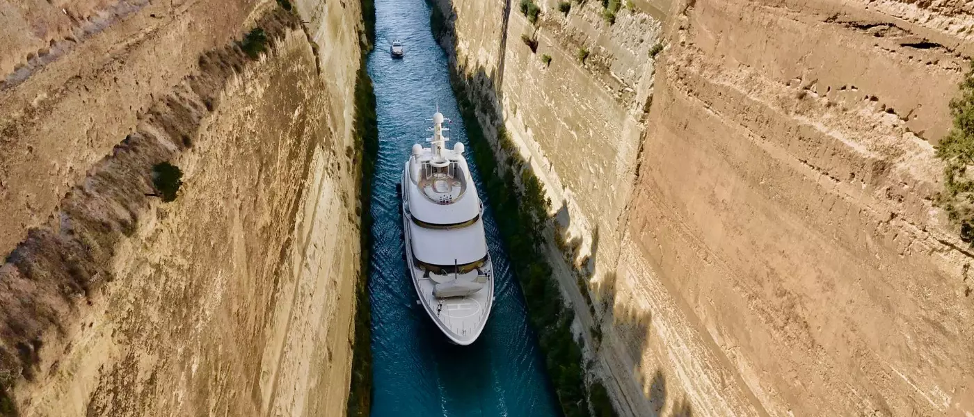 ship sailing through narrow waters